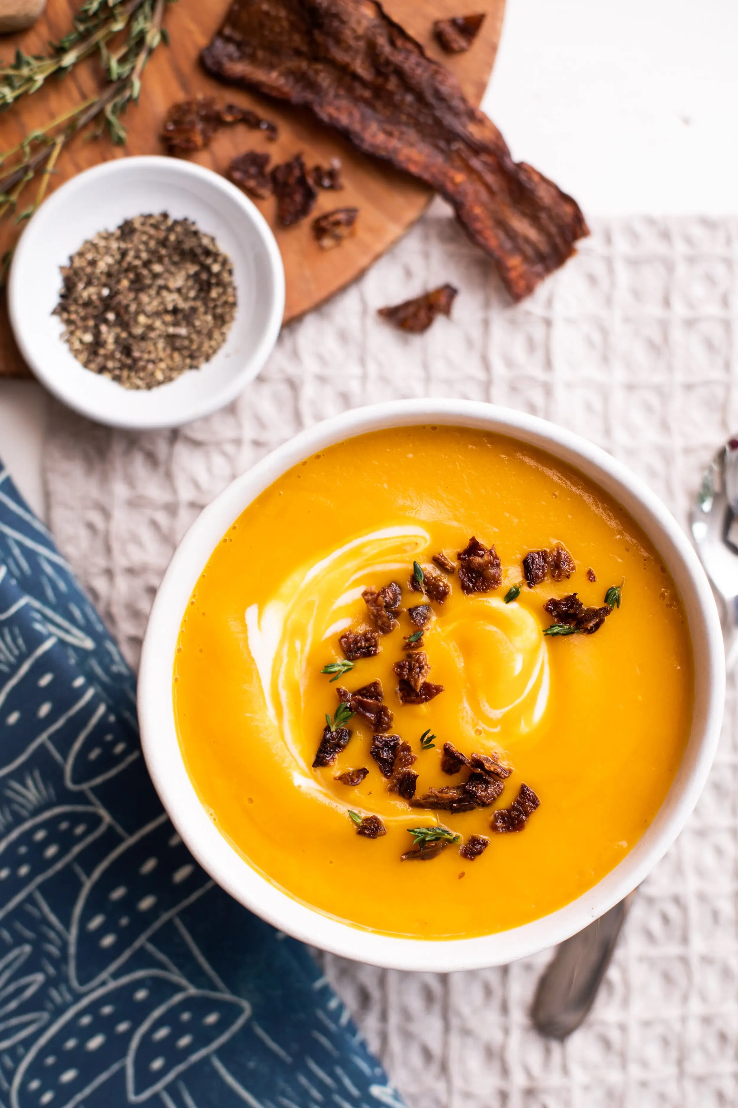 Bowl of soup withMyBacon garnish on top