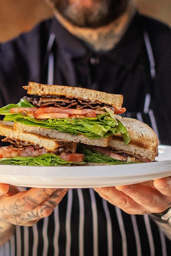 Chef Nick holding a freshly made MyBacon BLT